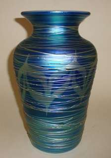 11 1/4 tall, iridescent art glass vase, with pulled feather and 