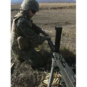  A Soldier Changes the Barrel of an M2 50 Caliber Machine Gun 