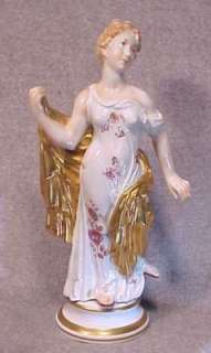 This porcelain statue is in very good vintage condition. She has minor 