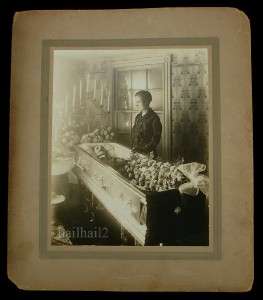   MORTEM YOUNG WOMAN GRIEVES OVER DEAD HUSBAND IN COFFIN TOUCHING  