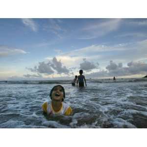 Child as She Plays in the Waves at a Beach in Port Blair, India 