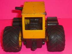 OLD UNNAMED TOY YELLOW METAL & PLASTIC TRACTOR  
