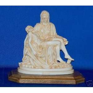  8 PLASTIC FIGURINE   PIETA WITH WOODEN BASE  LOVE OUR 