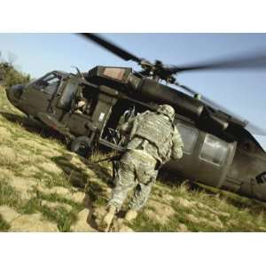 US Army Soldiers Board a UH 60 Black Hawk Helicopter Premium Poster 