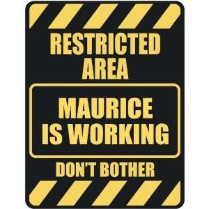   RESTRICTED AREA MAURICE IS WORKING  PARKING SIGN