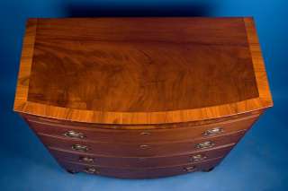 The top is a striking flame mahogany bordered by 3 yew crossbanding.