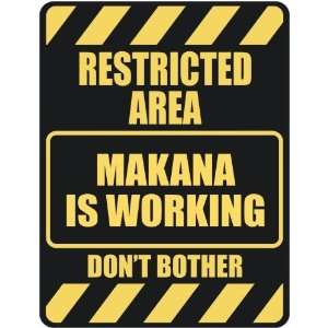   RESTRICTED AREA MAKANA IS WORKING  PARKING SIGN