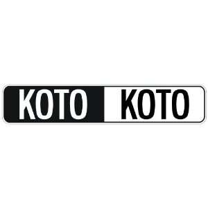   NEGATIVE KOTO  STREET SIGN