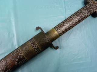   knife with wood scabbard. On the scabbard few brass rings missed