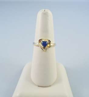   prong setting at the point of the heart ring is in excellent condition