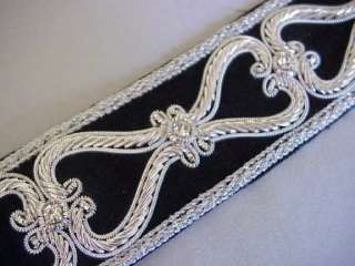 Approximately 1 ½ inches wide. This auction is for 1 yard of trim.