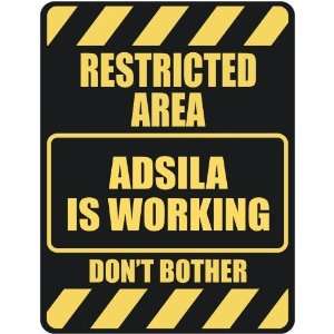   RESTRICTED AREA ADSILA IS WORKING  PARKING SIGN
