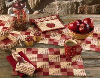 Apple Jack features four patterns in shades of red, wine and vanilla,