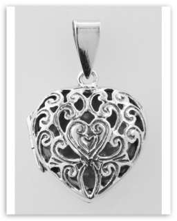   silver scroll design filigree heart locket the front of the heart