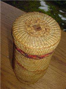 This is a Makah Indian basket woven over an old jar. It is 7 tall and 