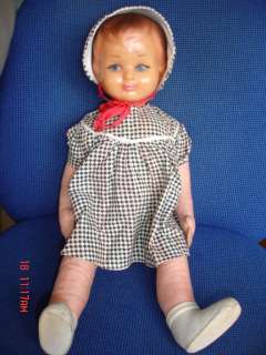 This is an antique doll with rubber head,straw body and cotton hands 